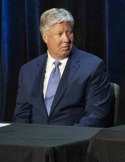 Pastor Robert Morris, left, and President Donald Trump listen as Bishop Harry Jackson, senior pastor at Hope Christian Church in Beltsville, Md