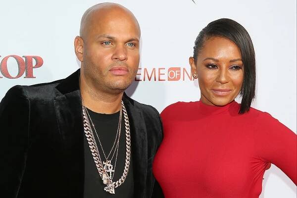 Stephen Belafonte and Mel B attend the premiere of Warner Brothers "Barbershop: The Next Cut" in Hollywood, California, on April 6, 2016. / AFP / JEAN BAPTISTE LACROIX (Photo credit should read JEAN BAPTISTE LACROIX/AFP/Getty Images)