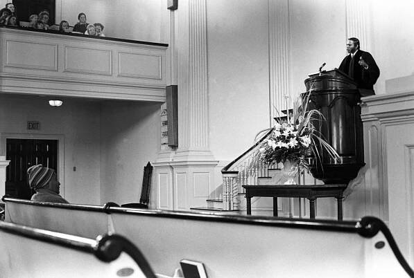 Rev. Eaton delivers a sermon from the All Souls pulpit, March 1974