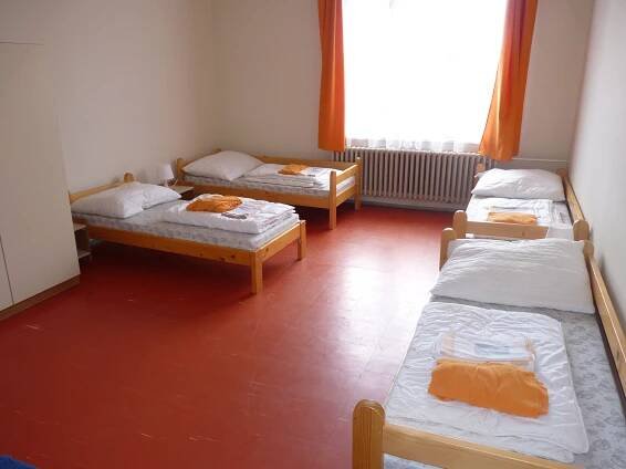 Postel nebo postele na pokoji v ubytování Hostel Bernarda Bolzana