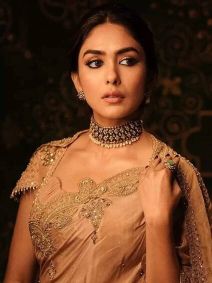 Mrunal Thakur makes a glamorous statement in custom-made golden saree