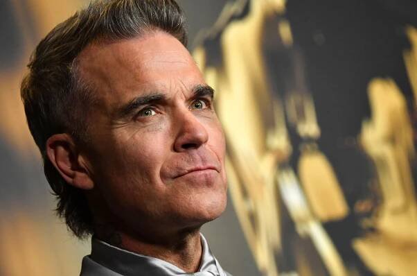 Robbie Williams Ties The Beatles for Most U.K. No. 1 Albums Ever