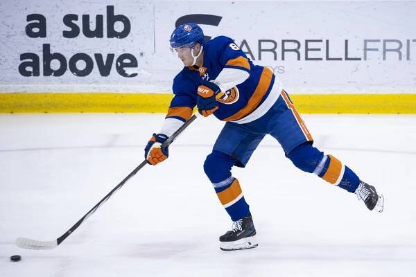 New York Islanders defenseman Noah Dobson (8) shoots during practice at the Northwell Health Ice Center, Thursday, Sept. 19, 2024, in East Meadow, NY. 