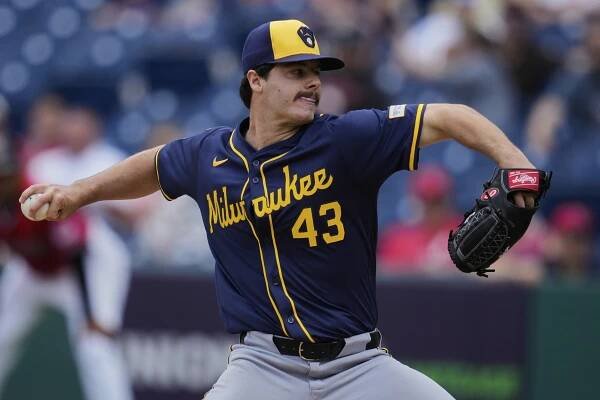 Milwaukee Brewers' Logan Henderson pitches in the first inning of a baseball game against the Cleveland Guardians 
