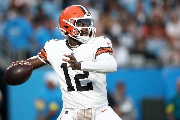 Quarterback Shedeur Sanders drops to pass in the first half during the NFL Preseason 2025 game against the Carolina Panthers at Bank of America Stadium on August 08, 2025 in Charlotte, North Carolina.