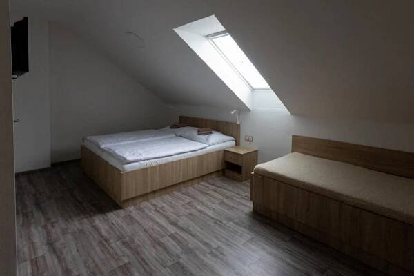 Postel nebo postele na pokoji v ubytování Apartmány Za Dvorem