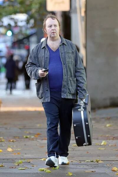Paul McCartney’s lookalike son James pictured grabbing a coffee with guitar - The Mirror