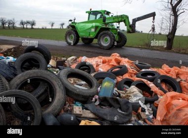 Illegal dumping of used tires discarded at county road, Czech Republic Stock Photo