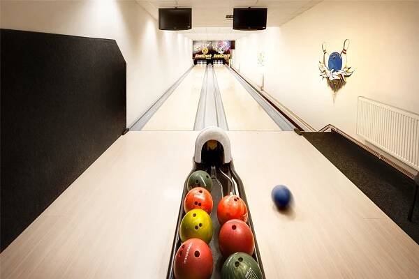 a bowling alley with balls on the lanes at Wellness hotel Lihovar in Třemošnice