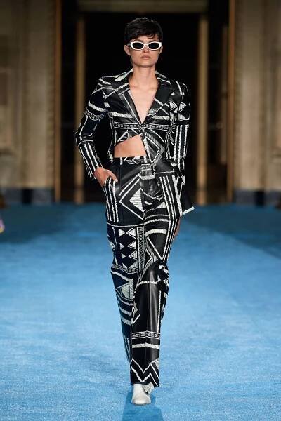Image may contain Clothing Apparel Sunglasses Accessories Accessory Human Person Fashion and Runway
