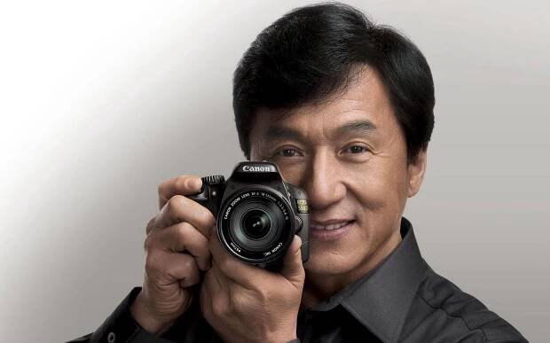 Jackie Chan in Action with Camera Wallpaper