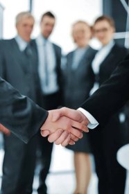 Download - Handshake isolated on business background — Stock Image