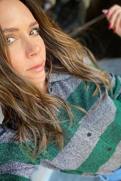 Image may contain Clothing Apparel Human Person Sweater and Finger