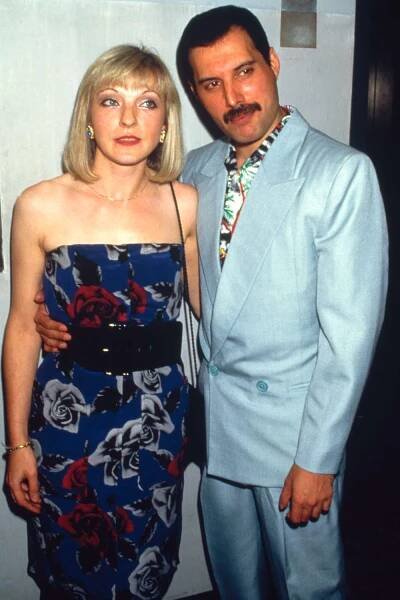 Singer Freddie Mercury with his friend Mary Austin at an after-party for Queen's Wembley concerts, Kensington Roof Gardens, London, 12th July 1986.