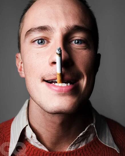 Image may contain Face Head Person Photography Portrait Adult Smoke and Smoking
