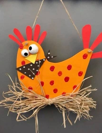 a paper bird hanging from a string