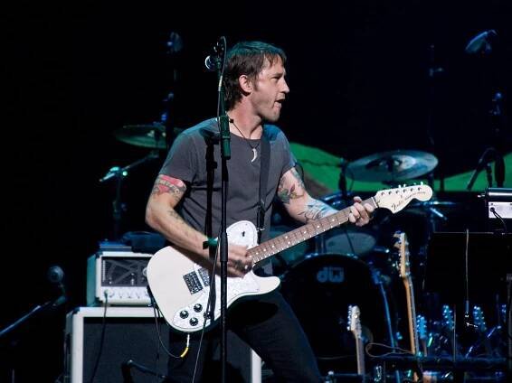 Chris Shiflett in 2012 playing his Telecaster Deluxe on stage.