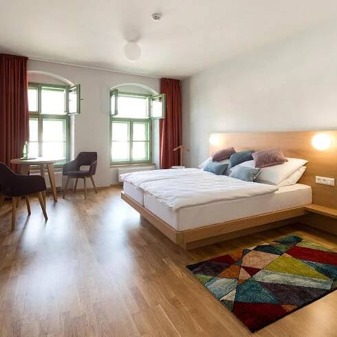 Postel nebo postele na pokoji v ubytování Hotel Tři knížata