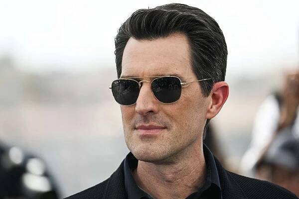 US director Joseph Kosinski poses during a photocall for the film "Top Gun : Maverick" at the 75th edition of the Cannes Film Festival in Cannes, southern France, on May 18, 2022.