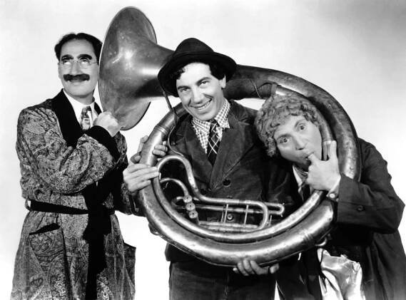A DAY AT THE RACES, from left: Groucho Marx, Chico Marx, Harpo Marx, 1937