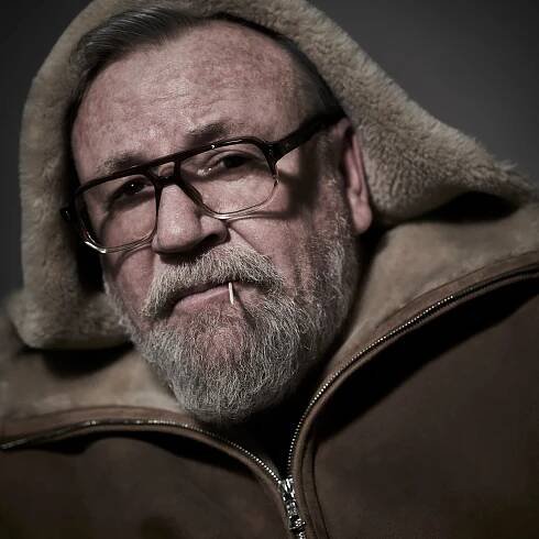 Ray wears Sheepskin Jacket by Connoly, Glasses by Jacques Marie Mage // 📸 : Gavin Bond