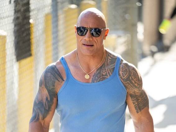 Dwayne Johnson is all about tiny vests and big biceps