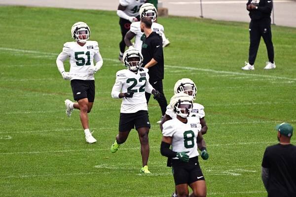 New York Jets players running drills at training camp.