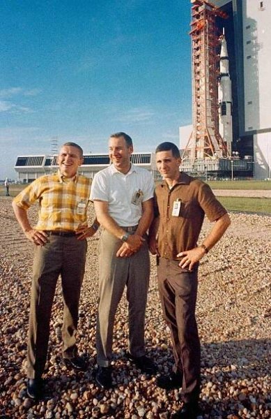 The crew of Apollo 8 ( (left to right) astronauts Frank Borman, commander; James A. Lovell Jr., command module pilot; and William A. Anders, lunar module pilot) stand in front of the Saturn 5 rocket as it heads to the launch pad on October 9, 1968 in Cape Canaveral, Florida.