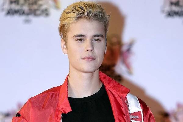 FILE - In this Nov. 7, 2015 file photo, Justin Bieber arrives at the Cannes festival palace in Cannes, southeastern France. Bieber is canceling the rest of his Purpose World Tour due to unforeseen circumstances. In a statement released Monday, July 24, 2017, his representatives didnt offer details about the cancellation but said the singer loves his fans and hates to disappoint them. He has been on the tour for the last 18 months, playing more than 150 shows in six continents. (AP Photo/Lionel Cironneau, File)