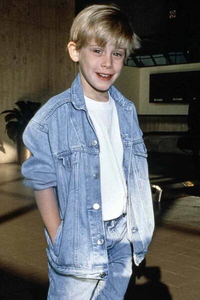 Macaulay Culkin attends an event, United States, circa 1990s. 