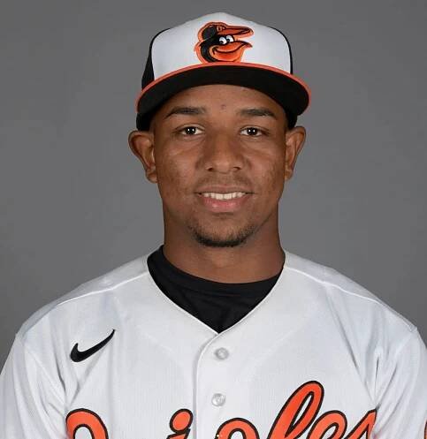 Headshot of a baseball player wearing an Orioles uniform.