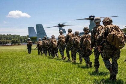 Naval Reserve Officer Training Corps (NROTC) Midshipmen prepare to board an MV-22B Osprey for an air insert exercise during their Summer Training Program at Marine Corps Base Camp Lejeune.