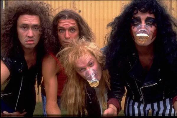 (L-R) Nigel Planer, Rik Mayall, Adrian Edmondson and Peter Richardson in The Comic Strip Presents... episode 'Bad News Tour', circa 1983. (Photo by TV Times via Getty Images)