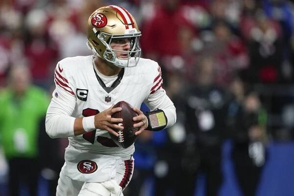 Brock Purdy runs with the ball during the 49ers' Week 6 win over the Seahawks.