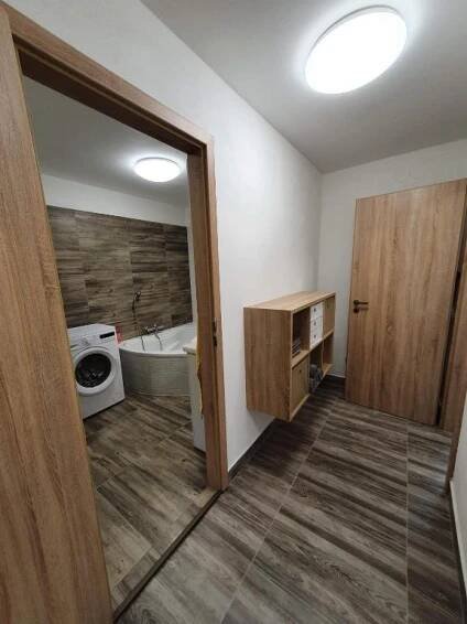 a bathroom with a tub and a toilet and a sink at Apartmány Nová duha Vavřinec in Vavřinec