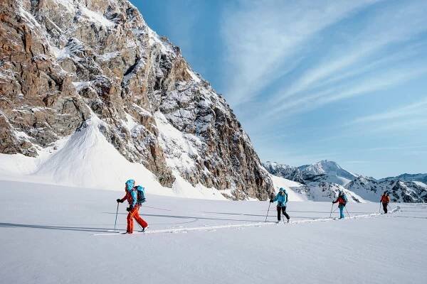 Skiers skiiing near Saas Fee in Switzerland