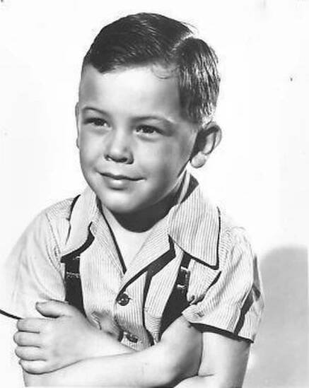 Bobby Driscoll with his arms crossed