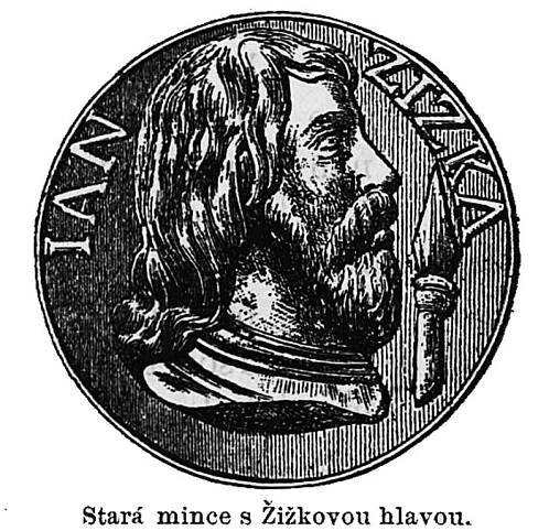 an image of a man with long hair and beards in a round medallion that reads,