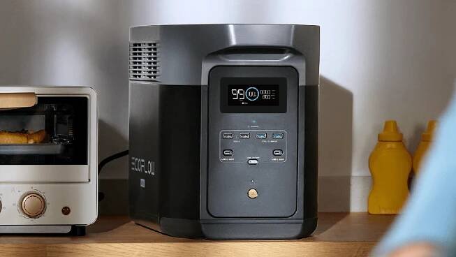 ecoflow delta 2 max power station sitting on counter with toaster oven and condiment bottles