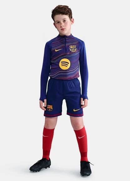 Classic Barça shorts in deep navy with red accents and yellow swoosh. Game-ready essentials.
