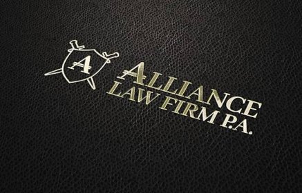 Alliance Law Firm embossed in gold foil text on black leather