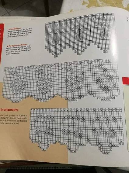 an open book with cross stitch patterns on it