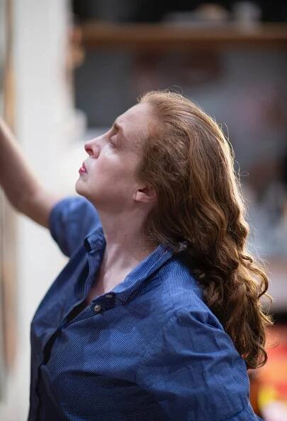 person engaged in an activity wearing a blue shirt