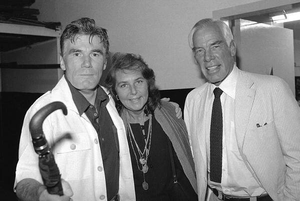 FILE - Actor Lee Marvin, right, and his wife, Pamela, visit with Mitchell Ryan, star of Arthur Miller's play 