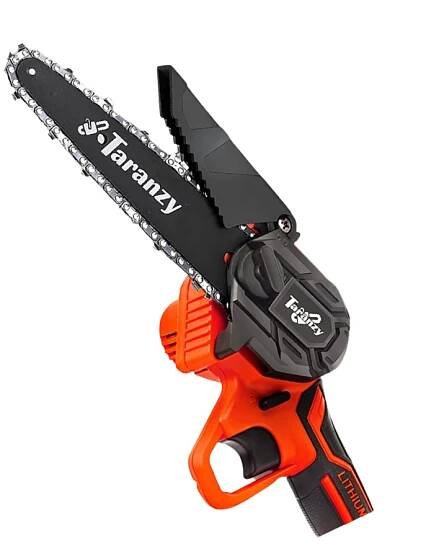 A chainsaw is sitting on a white surface.