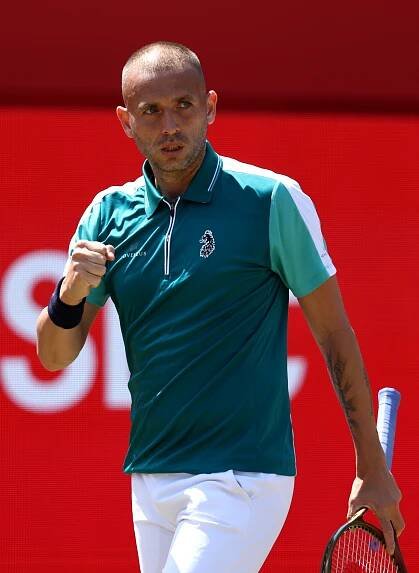 Daniel Evans of Great Britain celebrates a point during a tennis match.