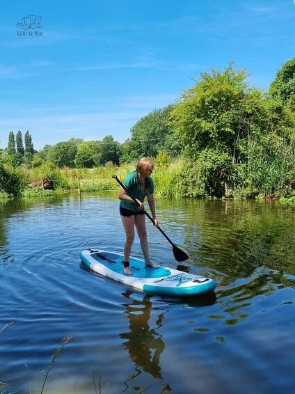 Girl on an EZ Kids Paddleboard in the Summer on a river