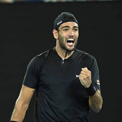 Matteo Berrettini passionately pumping his fist during a tournament Wallpaper
