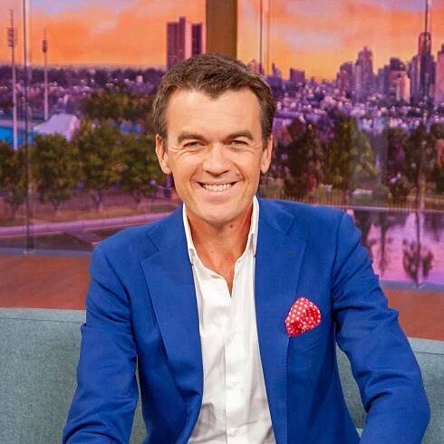 Michael Rowland sits on the News Breakfast couch in studio