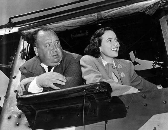 SHADOW OF A DOUBT, Director Alfred Hitchcok with Teresa Wright on set, 1943